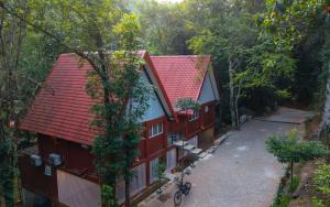 an overhead view of a house with red roofs at Leopard Eye Resort in Kitulgala