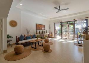 a living room with a couch and a table at Angkor Eden Boutique Hotel in Siem Reap