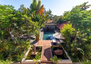 an aerial view of a house with a pool and trees at Angkor Eden Boutique Hotel in Siem Reap