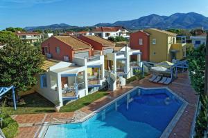an image of a villa with a swimming pool at Νηρηίδες Apartments Studios in Kyparissia
