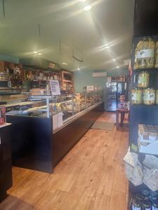a bakery with a counter with a lot of food at Civitas Locanda in Ghedi