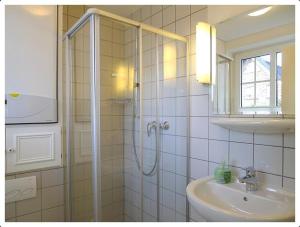 a bathroom with a shower and a sink at Haus-Kim in Tinnum +12 photos