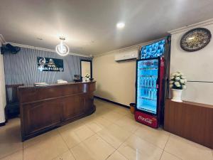 a bar with a soda machine in a room at HOTEL IHAM PARADISE - Near Mangalore Central Railway Station - Pets Not Allowed in Mangalore +29 photos