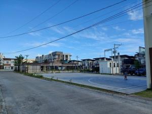 an empty basketball court on the side of a street at Affordable Stylish & Cozy Walk Up Condo in Minglanilla