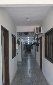 an empty hallway in a building with a hallwayngthngthngthngthngthngthngth at Hostal B&C in Angra dos Reis +28 photos