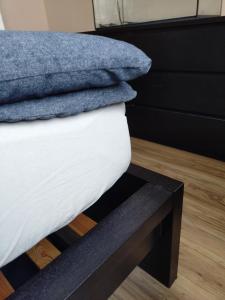 a close up of a bed with a drawer at Városközpont Tata in Tata +8 photos