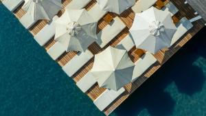 an aerial view of a yacht with umbrellas in the water at Flamm in Golturkbuku