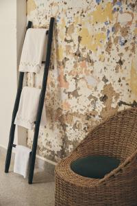 a towel rack and a basket in a room at Nbta House in Tangier