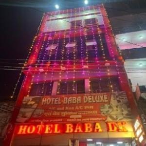 a building with colorful lights on the side of it at Hotel Baba Dx in Samastīpur
