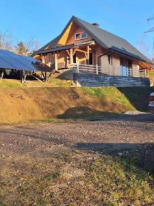 a house with a solar roof on a hill at CHATKA u TADKA in Nowy Sącz +7 photos
