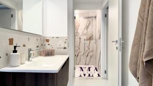 a bathroom with a sink and a shower at MAcase Apartments in Ferrara +41 photos