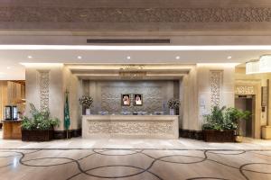 a lobby of a hotel with a reception desk at Violet Al Azizia Hotel MASJID Al Qatari in Mecca +180 photos