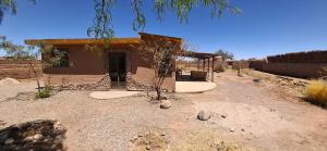 a small house in the middle of a desert at Cabaña Laynaturi in San Pedro de Atacama