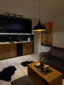 a living room with a couch and a table at ANKA APARTMENT in Štip +17 photos
