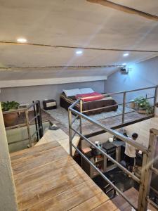 a man standing in a room with two bunk beds at Manipa Loft 2 in Cafayate