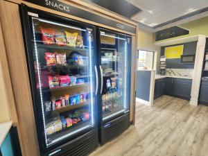 a refrigerator filled with lots of food in a kitchen at Days Inn by Wyndham Dickinson TX in Dickinson