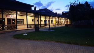 a building with a courtyard in front of it at Apartmán 4you in Buchlovice