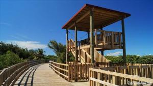 a wooden boardwalk with a building on top of it at El Apartamento Nuestro in Isabela