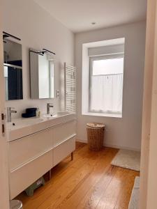 a bathroom with a sink and a window at El-Argalora-Bihan in Plobannalec-Lesconil +71 photos