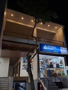 a sign on the front of a retail store at MG Stay AYODHYA in Faizābād