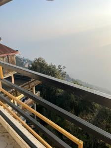 a view from the balcony of a house at Himavati Retreat in Darjeeling