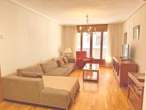 a living room with a couch and a table at Av Valladolid 45 in Soria