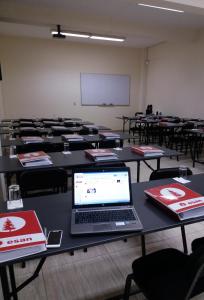 a classroom with tables with a laptop on it at Hotel Casa Campo by Cassana in Arequipa