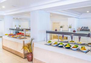 a buffet line with plates of food on display at ESMA CLOVE RESORT&SPa in Eskiömerler