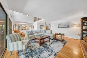 a living room with a couch and a table at Emerald Shores - Lakefront, Private Dock & Fire Pit in Moneta