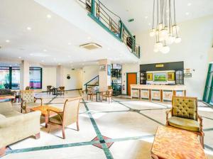 a lobby with chairs and tables in a building at ESMA CLOVE RESORT&SPa in Eskiömerler