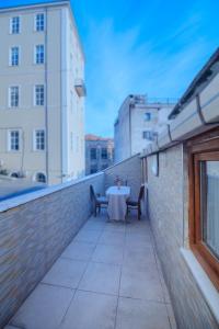 a table on the balcony of a building at White Moon Suites in Istanbul