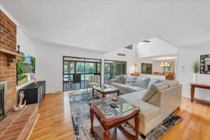 a living room with a couch and a fireplace at Emerald Shores - Lakefront, Private Dock & Fire Pit in Moneta