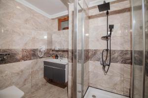 a bathroom with a shower and a sink at White Moon Suites in Istanbul +49 photos
