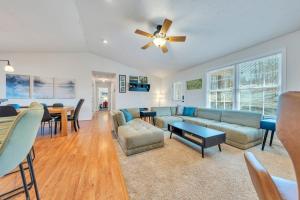 a living room with a couch and a ceiling fan at Whisper Haven - Private dock & Pet friendly in Moneta
