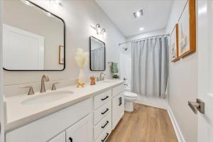 a white bathroom with a sink and a toilet at Lake Twin Cove - New! in Moneta +26 photos