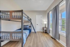 a bedroom with two bunk beds and a window at Lake Twin Cove - New! in Moneta