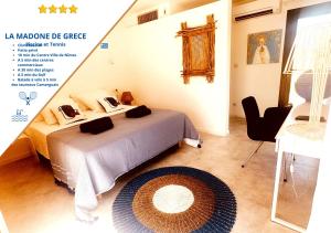 a room with a bed and a table and a desk at Les Madones in Nîmes +77 photos