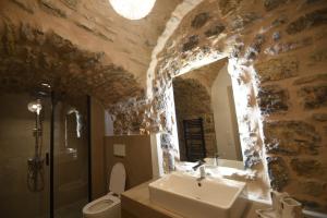 a bathroom with a sink and a toilet at Armathia Accommodation in Mestá +21 photos