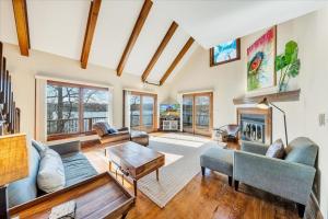 a living room filled with furniture and a fireplace at Pine Knob Point - Lakehouse w/ Private Dock in Moneta