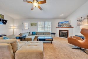 a living room with a couch and a fireplace at Whisper Haven - Private dock & Pet friendly in Moneta