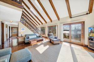 a living room with a couch and a table at Pine Knob Point - Lakehouse w/ Private Dock in Moneta
