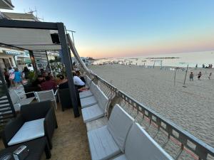 a restaurant on the beach with a view of the beach at Yellow Dream B&B 2 in Torre Melissa