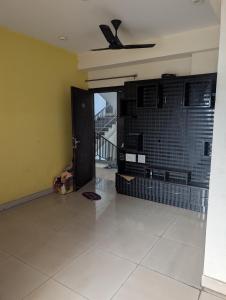 a room with a ceiling fan and a tile floor at Panchsheel Greens 2 in Ghaziabad