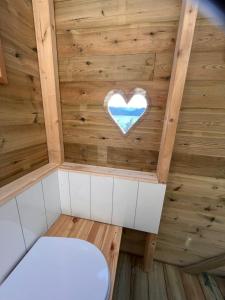 a small sauna with a heart on the ceiling at Villa Vannes in Skånevik