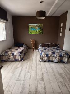 a bedroom with two beds in a room at Apartamento Buendia in Buendía