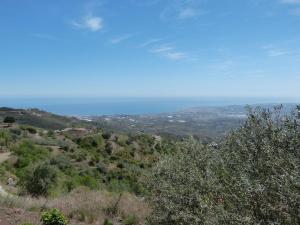 a view of a hill with the ocean in the background at Belvilla by OYO Vista Maravilla in Arenas