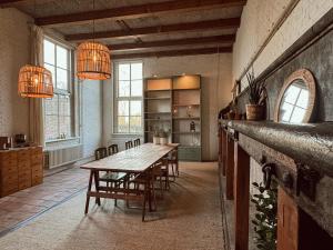 a large dining room with a table and chairs at Lizzy's B&B in Maarssen