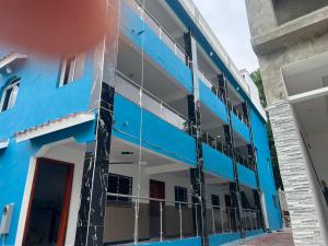 an exterior view of a blue building at Brisas del mar 2c in Santa Cruz de Barahona