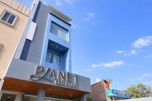 a building with a sign for a dance studio at Planet Eco Stays - Near Mahakal Temple in Ujjain