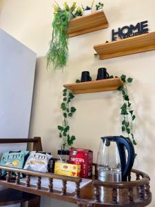 a kitchen counter with a coffee maker on a table at Yousrys Nest Cozy Rooftop Studio in New cairo